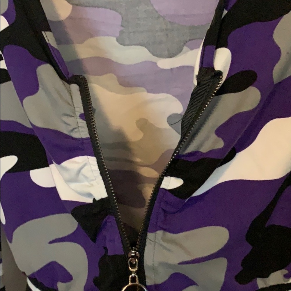 A purple/white/black/grey camp cropped zipper top